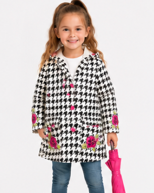 Child wearing a houndstooth patterned coat with floral accents, blue jeans, yellow boots, and holding a pink umbrella on a white background.