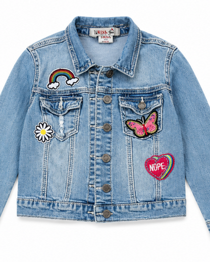 Blue denim jacket with colorful patches on a white background
