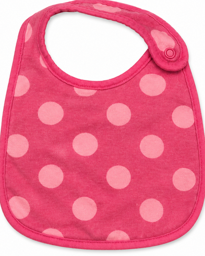 Pink bib with white polka dots on a white background