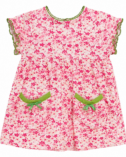Pink floral dress with green trim on a white background
