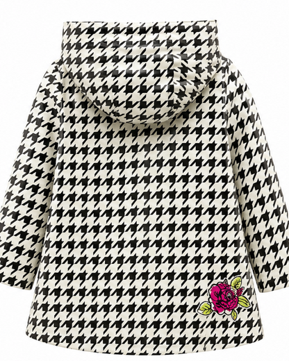 Houndstooth patterned coat with a floral patch on a white background
