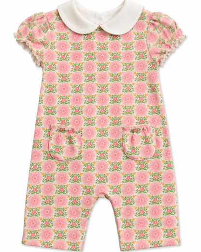 Floral baby romper with a white collar on a white background