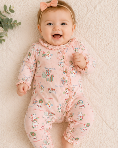 Baby wearing a pink floral onesie on a soft beige background