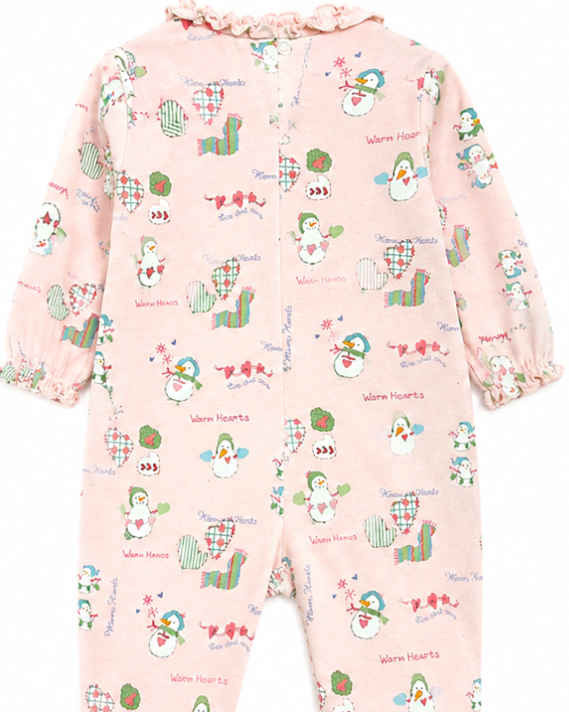 Baby onesie with colorful animal pattern on a pink background