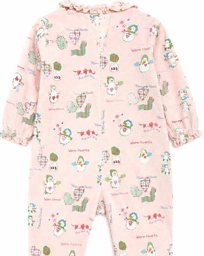 Baby onesie with colorful animal pattern on a pink background