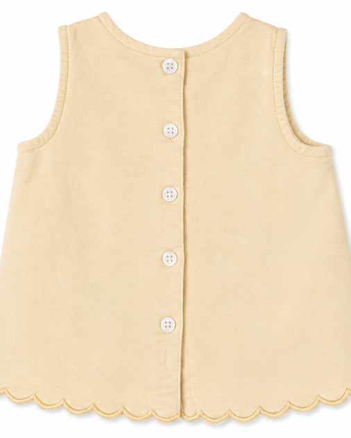 Yellow sleeveless button-up garment on a white background